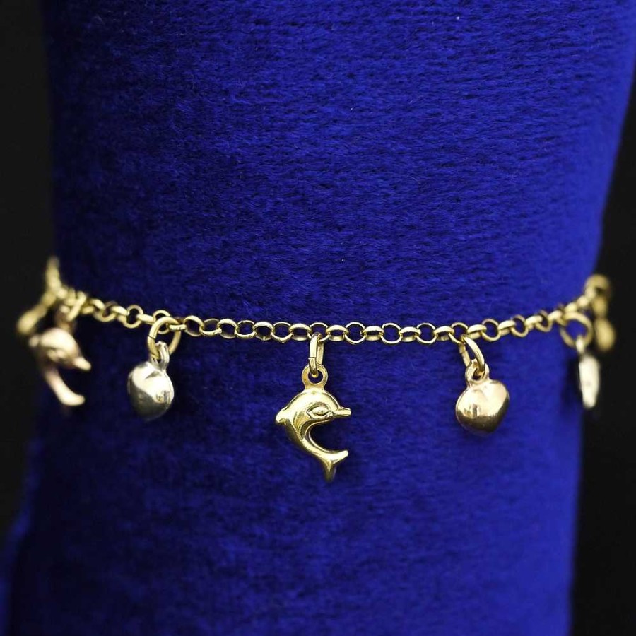 Pulsera Con Colgantes De Delfines Y Corazones. Montada En Oro Bicolor De 18 Ktes. | Joyería Finarte Online